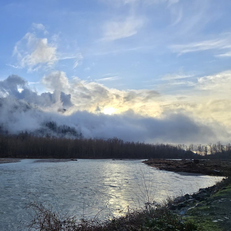Low clouds cast an eerie shade as the sun goes down on the Vedder River. 