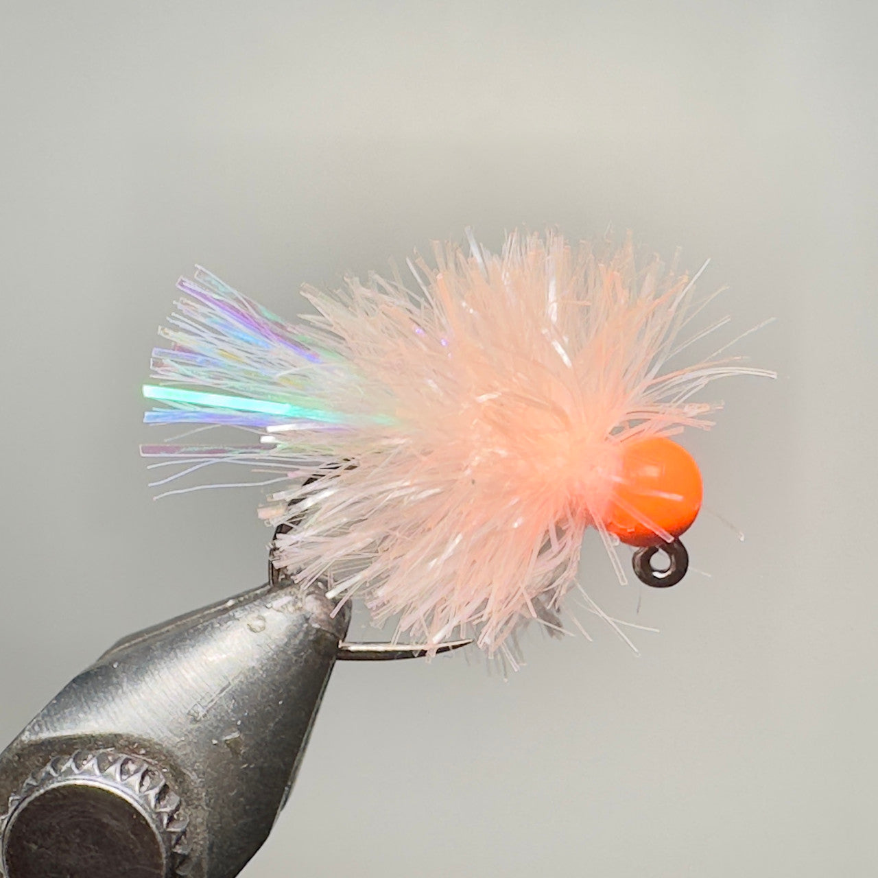 Biscuit with orange tungsten bead